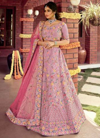 Catch All The Limelight At The Next Wedding You Attend Wearing This Heavy Designer Lehenga Choli In Pretty Colored Blouse Paired With Ptrtty Colored Lehenga And Dupatta. Its Pretty Embroidered Blouse And Dupatta Are Fabricated on Soft Net Paired With Embroidered Organza Fabricated Lehenga And Blouse.