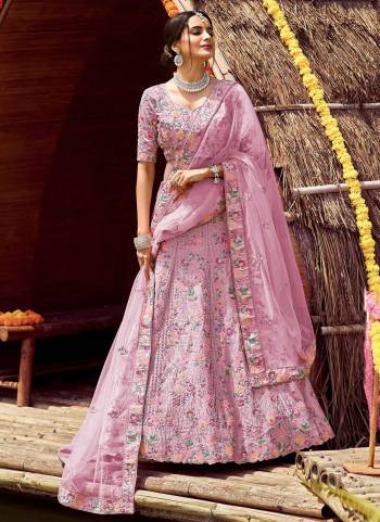 Get Ready For The Upcoming Wedding Season With This Very Beautiful Heavy Designer Lehenga Choli With  Embroidery In Pretty Color Paired With Pretty Colored Dupatta. This Lehenga Choli Is Fabricated On Satin Silk Paired With Soft Net Fabricated Dupatta. Buy Now