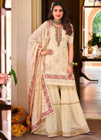 Here Is A Very Beautiful Designer Sharara Suit In Pretty Colored Top is Fabricated On Georgette Pair With Santoon Bottom And Georgette Dupatta Beautified With HHeavy Designer Sequance Embroidery Work