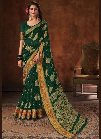 Enhnace Your Beauty Wearing This Pretty Colored Saree Paired With Matching Colored Blouse. This Saree Is Fabricated On Cotton Paired With Cotton Fabricated Blouse. It Is Beautified Wevon Designer,Printed.