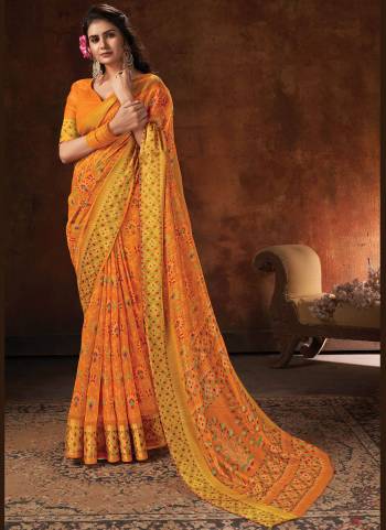 Enhnace Your Beauty Wearing This Pretty Colored Saree Paired With Matching Colored Blouse. This Saree Is Fabricated On Cotton Paired With Cotton Fabricated Blouse. It Is Beautified Wevon Designer,Printed.