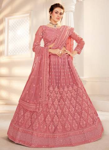 For A Amazing Look , Grab These Heavy Designer Lehenga Choli in All Over Pretty Colored.Its Lehenga is Fabricated On Net Based Pair With Net Blouse And Net Dupatta.Beautified With Heavy Cording Embroidery,Zarkan Work