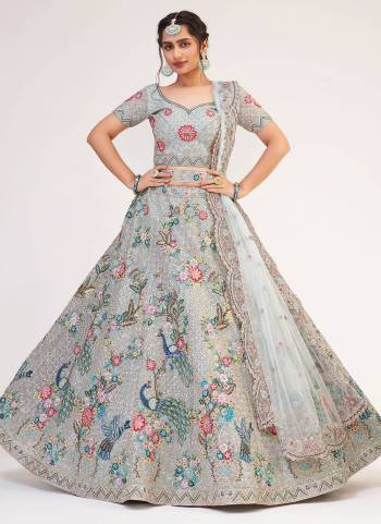 For A Designer Look , Grab These Heavy Designer Lehenga in Beautiful Colored.its Lehenga And Blouse Are Fabricated On Net Based Pair WIth Net Dupatta Beautified With Heavy Designer Work