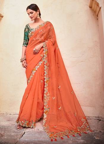 Grab These Beautiful Saree In Pretty Colored Pair With Matching Blouse.Its Saree is Fabricated On Organza Pair With Art Silk Blouse.Beautified With Heavy Work.