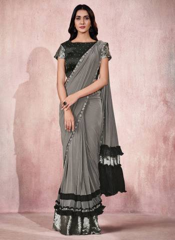 Adorn The Angelic Look Wearing This Readymade Saree In Lovely Color Paired With Designer?Blouse. This Saree Is Fabricated On Lycra Based.Come With Heavy Work. Buy This Saree Now