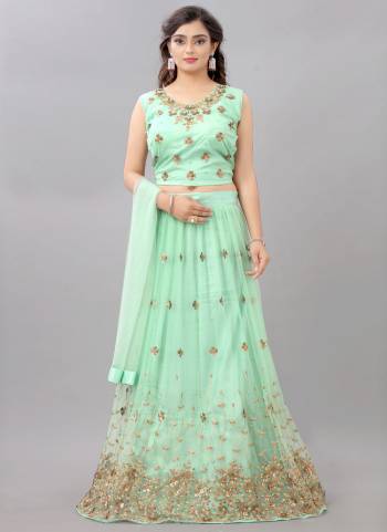 For A Fair Beauty, Grab This Lovely Designer Lehenga In All Over Pretty Colored.This Lehenga Is Fabricated On Net Based Beautified With Designer Work.