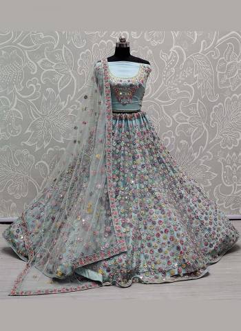 You Will Definitely Earn Lots Of Compliments Wearing This Designer Lehenga Come With Net Based Fabric Pair With Net Blouse And Dupatta.Its Beautified With Heavy Designer Work.