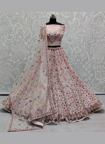 You Will Definitely Earn Lots Of Compliments Wearing This Designer Lehenga Come With Net Based Fabric Pair With Net Blouse And Dupatta.Its Beautified With Heavy Designer Work.