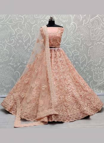 You Will Definitely Earn Lots Of Compliments Wearing This Designer Lehenga Come With Net Based Fabric Pair With Net Blouse And Dupatta.Its Beautified With Heavy Designer Work.