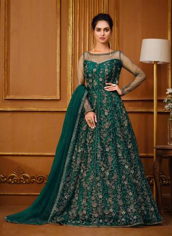 Rich And Elegant Looking Designer Suit Is Here In Pretty Colored Top Paired With Matching Colored Bottom And Dupatta. Its Top Is Fabricated On Soft Net Pair With Japan Crepe Bottom And Soft Net Dupatta.Beautified With  Designer Embroidery Work.