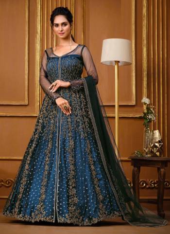 Rich And Elegant Looking Designer Suit Is Here In Pretty Colored Top Paired With Matching Colored Bottom And Dupatta. Its Top Is Fabricated On Soft Net Pair With Japan Crepe Bottom And Soft Net Dupatta.Beautified With  Designer Embroidery Work.