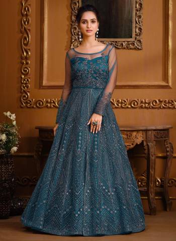 Rich And Elegant Looking Designer Suit Is Here In Pretty Colored Top Paired With Matching Colored Bottom And Dupatta. Its Top Is Fabricated On Soft Net Pair With Japan Crepe Bottom And Soft Net Dupatta.Beautified With  Designer Embroidery Work.