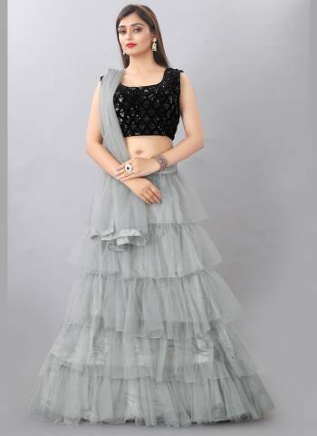 For A Different Look , Grab These Beautiful Lehenga in Lovely Colored Pair With Blouse And Dupatta.These Lehnega is Fabricated On Net Based Pair With Velvet Blouse And Net Dupatta.Its Beautified With Designer Embroidery Work