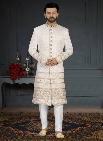 Take your ethnic style quotient to the next level by wearing this fashionable Set.These Sherwani is Fabricated On Jacquard Silk Pair With Dupion Silk Bottom .Its Come With Heavy Designer Work.