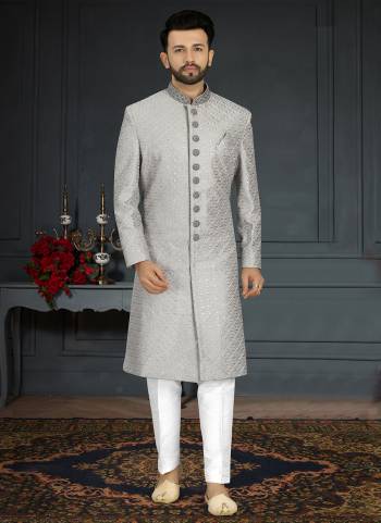 Take your ethnic style quotient to the next level by wearing this fashionable Set.These Sherwani is Fabricated On Jacquard Silk Pair With Dupion Silk Bottom .Its Come With Heavy Designer Work.