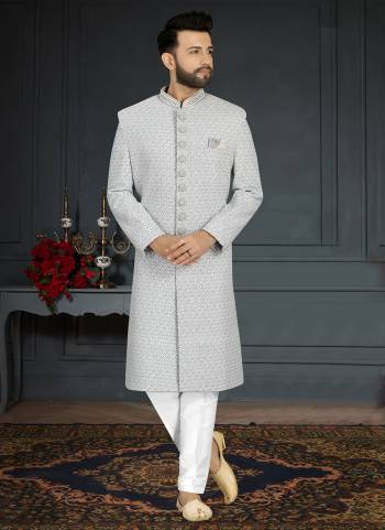 Take your ethnic style quotient to the next level by wearing this fashionable Set.These Sherwani is Fabricated On Jacquard Silk Pair With Dupion Silk Bottom .Its Come With Heavy Designer Work.