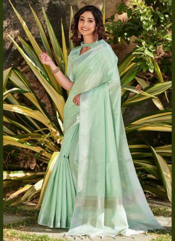 Grab These Beautiful Saree in All Over Fine Colored.These Saree And Blouse Are Fabricated On Tissue Linen Based.Its Beautified With Silver Jari Wevon Temple Designer Work.