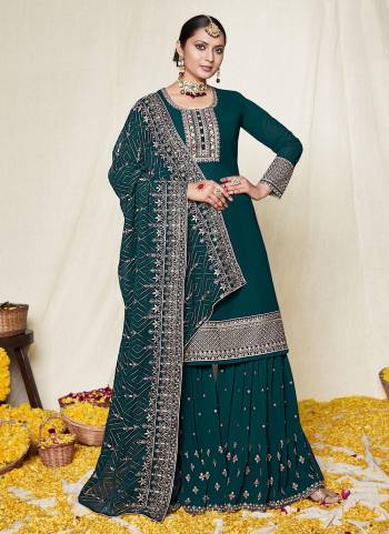 For A Designer Look,Grab These Sharara Suit in Lovely Colored Pair With Bottom And Dupatta.These Top And Dupatta Are Fabricated On Georgette Pair With Santoon Bottom.Its Beautified With Heavy Designer Work.