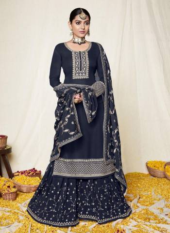 For A Designer Look,Grab These Sharara Suit in Lovely Colored Pair With Bottom And Dupatta.These Top And Dupatta Are Fabricated On Georgette Pair With Santoon Bottom.Its Beautified With Heavy Designer Work.