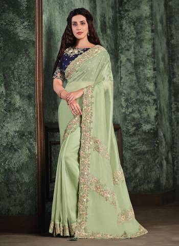 For A Designer Look,Grab These Saree in All Over Beautiful Colored.These Saree is Fabricated On Net Organza Pair Wth Raw Silk Blouse.Its Beautified With Heavy Designer Work.