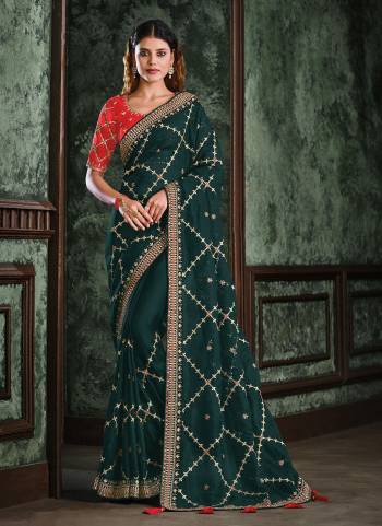 For A Designer Look,Grab These Saree in All Over Beautiful Colored.These Saree is Fabricated On Net Organza Pair Wth Raw Silk Blouse.Its Beautified With Heavy Designer Work.