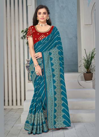 Enhance Your Beauty Wearing This Saree In Lovely Color Paired With Blouse. This Saree is Fabricated on Art Silk Pair WIth Satin Silk Blouse.Its Beautified With Designer Work.