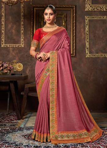 Add This Pretty Attractive Saree To Your Wardrobe.These Saree is Fabricated On Vichitra Silk Pair With Phantom Silk Blouse.Its Beautified With Designer Work.Buy Now