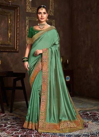 Add This Pretty Attractive Saree To Your Wardrobe.These Saree is Fabricated On Vichitra Silk Pair With Phantom Silk Blouse.Its Beautified With Designer Work.Buy Now