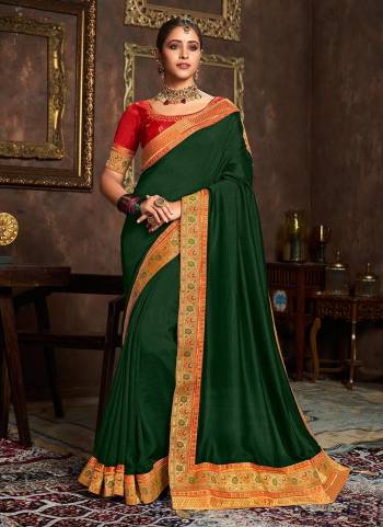 Add This Pretty Attractive Saree To Your Wardrobe.These Saree is Fabricated On Vichitra Silk Pair With Phantom Silk Blouse.Its Beautified With Designer Work.Buy Now