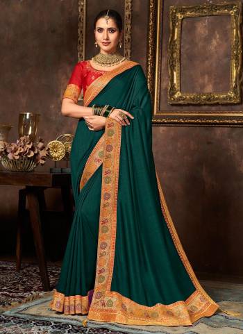 Add This Pretty Attractive Saree To Your Wardrobe.These Saree is Fabricated On Vichitra Silk Pair With Phantom Silk Blouse.Its Beautified With Designer Work.Buy Now