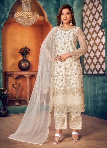 Earn Lots Of Compliments Wearing This Suit In Beautiful Colored.These Suit is Fabricated On Net Pair With Satin Bottom And Net Dupatta.Its Beautified With Heavy Designer Embroidery Work.