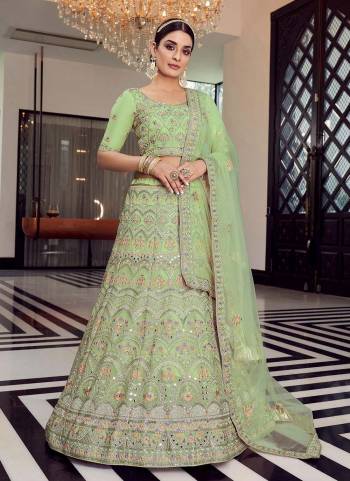 Enhance Your Personality Weaing This Beautiful Colored Lehenga.These Lehenga And Blouse Are Fbaricated On Organza Pair With Soft Net Blouse.Its Beautified With Heavy Designer Work.