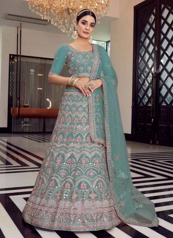 Enhance Your Personality Weaing This Beautiful Colored Lehenga.These Lehenga And Blouse Are Fbaricated On Organza Pair With Soft Net Blouse.Its Beautified With Heavy Designer Work.