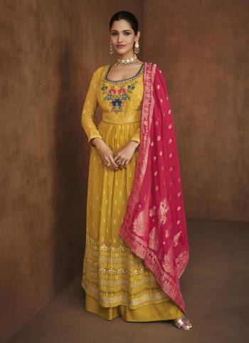 Grab This Lovely Plazzo Suit in Pretty Colored.These Top And Bottom Are Fabricated On Georgette Pair With Banarasi Jacquard Dupatta.Its Beautified With Heavy Embroidery Work.