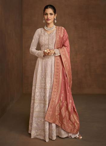 Grab This Lovely Plazzo Suit in Pretty Colored.These Top And Bottom Are Fabricated On Georgette Pair With Banarasi Jacquard Dupatta.Its Beautified With Heavy Embroidery Work.