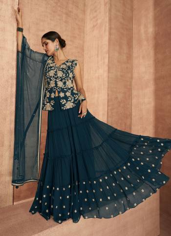 For A Designer Look,Grab These Sharara Suit in All Over Fine Colored These Top And Bottom Are Fabricated On Faux Georgette Pair With Butterfly Net Dupattta.Its Come With Heavy Designer Embroidery Work.