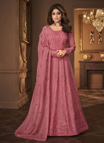 For A Designer Look,Grab These Designer Suit In All Over Fine Colored.These Top And Dupatta Are Fabricated On Georgette Pair With Silk Santoon Bottom.Its Beautified With Heavy Designer Work.