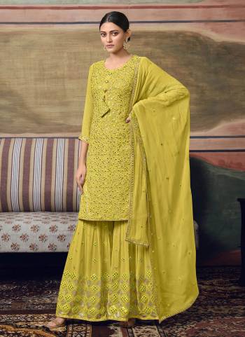 For A Different Look, Grab These Plazzo Suit in Fine Colored.These Top And Bottom Are Fabricated On Faux Georgette Pair With Faux Georgette Dupatta.Its Beautified With Designer Thread,Mirror Embroidery Work.