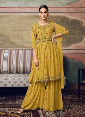 For A Different Look, Grab These Plazzo Suit in Fine Colored.These Top And Bottom Are Fabricated On Faux Georgette Pair With Faux Georgette Dupatta.Its Beautified With Designer Thread,Mirror Embroidery Work.