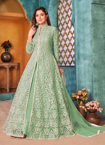 Here Is An Attractive Looking Beautiful Colored Suit.These Suit And Dupatta is Fabricated On Net Pair With Santoon Bottom.Its Beautified With Cording,Sequance Embroidery Work. 