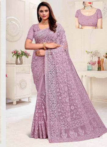 For A Different Look,Grab These Beautiful Colored Saree.These Saree And Blouse Are Fabricated On Net.Its Beautified With Heavy Designer Embroidery And Stone Work.