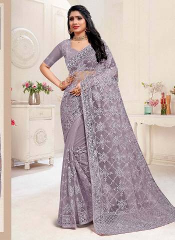 For A Different Look,Grab These Beautiful Colored Saree.These Saree And Blouse Are Fabricated On Net.Its Beautified With Heavy Designer Embroidery And Stone Work.