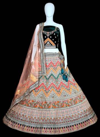 For A Beautiful Look,Grab These Designer Lehenga Choli in All Over Fine Colored.These Blouse And Lehenga Are Fabricated On Velvet Pair With Soft Net Blouse.Its Beautified With Heavy Designer Thread Embroidery Work.