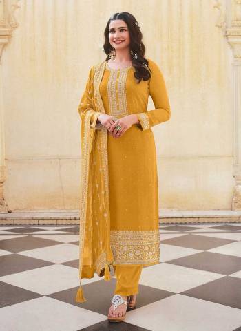 For A Designer Look,Grab These Beautiful Colored Suit Pair With Bottom And Dupatta.These Top is Fabricated On Dola Silk Pair With Santoon Bottom And Faux Georgette Dupatta.Its Beautified With Heavy Designer Embroidery And Swarovski Work.