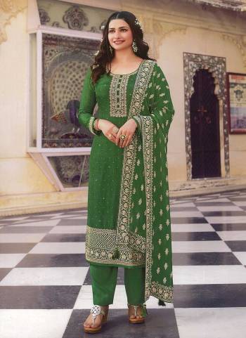 For A Designer Look,Grab These Beautiful Colored Suit Pair With Bottom And Dupatta.These Top is Fabricated On Dola Silk Pair With Santoon Bottom And Faux Georgette Dupatta.Its Beautified With Heavy Designer Embroidery And Swarovski Work.