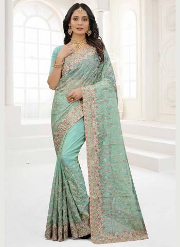 Grab These Saree in Fine Colored Pair With Matching Colored Blouse.These Saree And Blouse Are Fabricated On Organza.its Beautified With Designer Work.