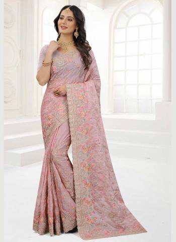 Grab These Saree in Fine Colored Pair With Matching Colored Blouse.These Saree And Blouse Are Fabricated On Organza.its Beautified With Designer Work.