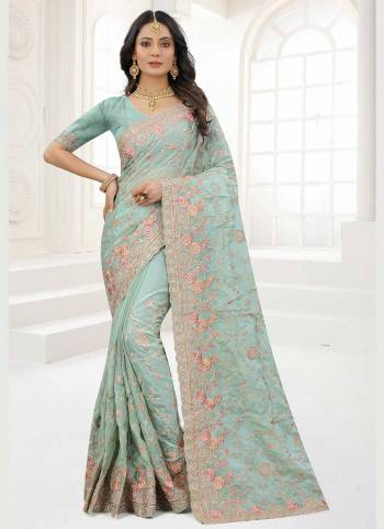 Grab These Saree in Fine Colored Pair With Matching Colored Blouse.These Saree And Blouse Are Fabricated On Organza.its Beautified With Designer Work.