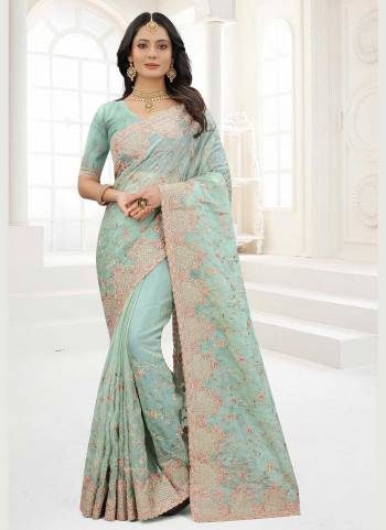 Grab These Saree in Fine Colored Pair With Matching Colored Blouse.These Saree And Blouse Are Fabricated On Organza.its Beautified With Designer Work.