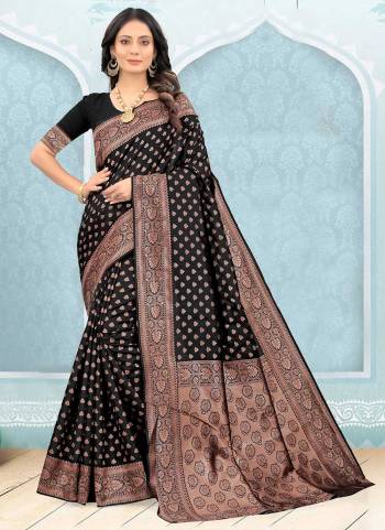 Grab These Black Colored Saree Pair With Black Colored Blouse.These Saree And Blouse Are Fabricated On Litchi Silk.Its Beautified With Heavy Jari Wevon Designer Work.